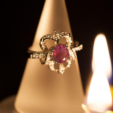 1.72ct natural alexandrite oval gemstone ring in 18k white gold with diamond accents, showcasing strong color change from green to reddish-purple.